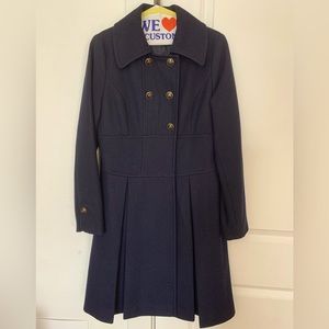 Knee length women’s wool overcoat.